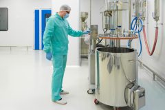 Pharmaceutical technician in sterile environment at pharmacy industry
